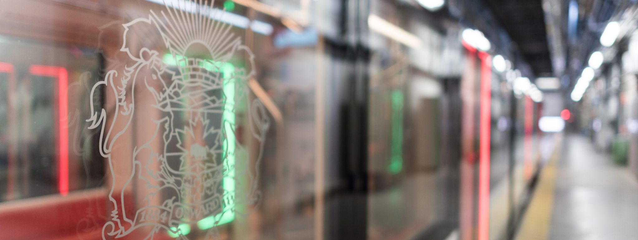 CTrain platform with a train moving through.