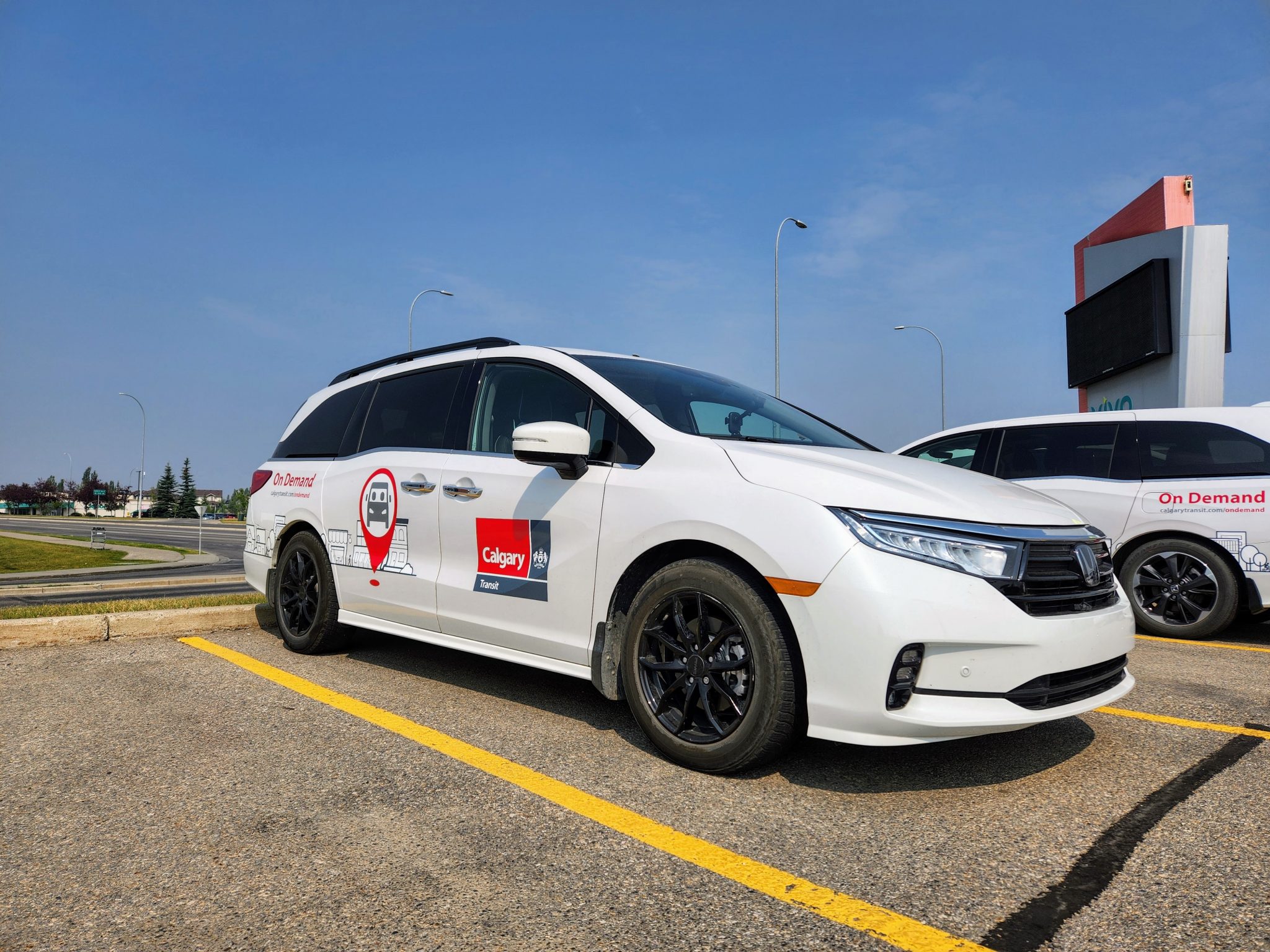 An On Demand vehicle parked.